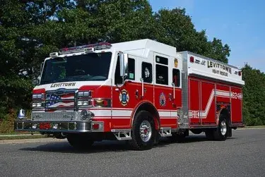 Front-left exterior view showing grille, cab windows, and rescue body