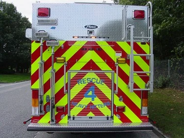 Direct rear view showing chevron rear doors and warning lights