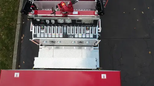 Aerial top-down rear-right view showing hosebed area and rear chevron panel
