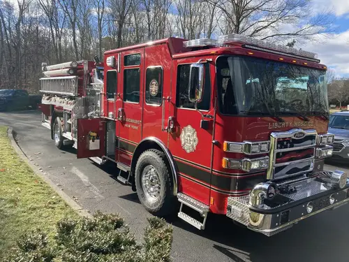 Front-right exterior view showing chrome bumper, grille, and cab corner