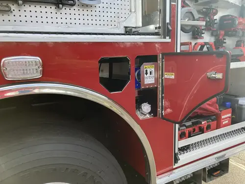 Center console close-up showing radio stack, switches, and charging mounts