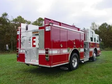 Rear-right exterior view showing rear body panel and side compartment doors