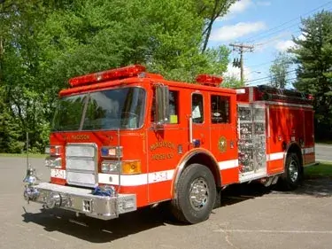 Pumper front-left exterior view showing enclosed cab and side compartments