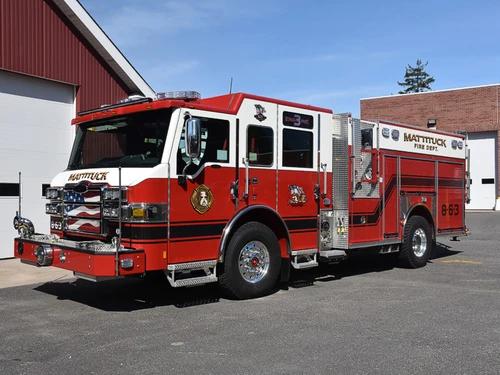 Pumper front-left exterior view showing enclosed cab and side compartments