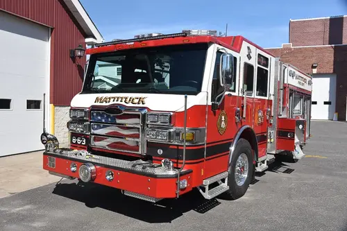 Front-left exterior close view showing grille, bumper, and cab