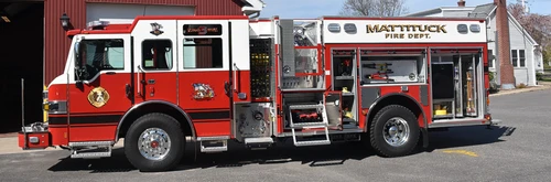 Pumper driver-side profile view showing full body and closed compartments