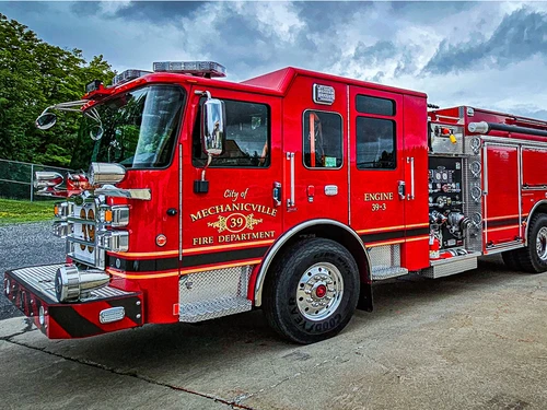 Pumper front-left exterior view showing grille, bumper, and side body