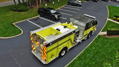 Aerial top-down rear view showing hosebed rails and rear connection panel