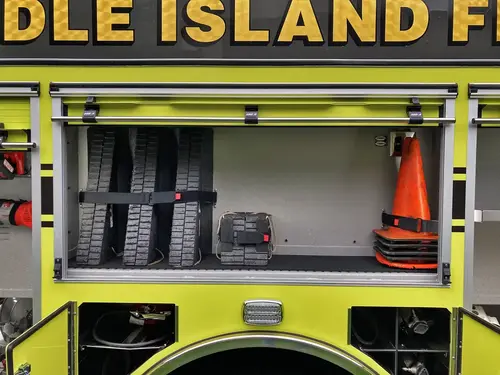 Hosebed close-up showing stacked hose loads above rear chevrons