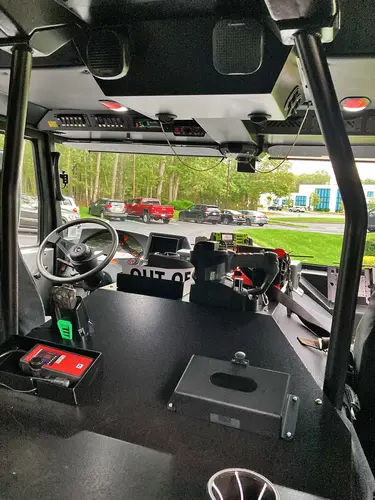 Cab interior wide view showing front seats, console, and dashboard