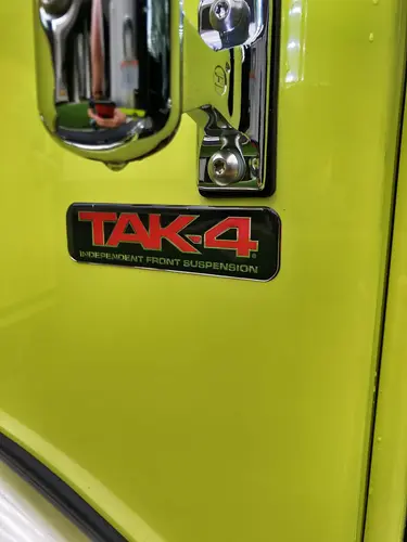 Center console close-up showing radios, toggle switches, and charging mounts