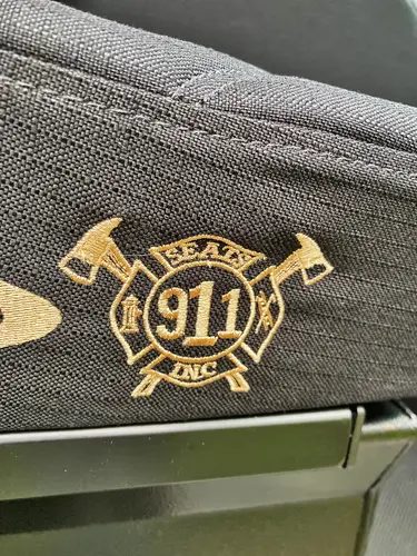 Rear crew seat close-up showing SCBA brackets and restraint straps