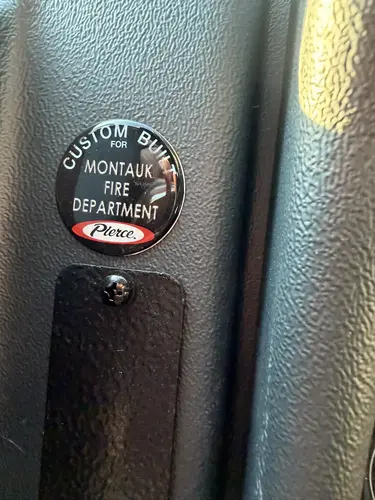 Cab control close-up showing parking brake knob and nearby panel switch