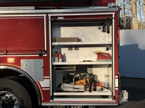 Open side compartment view showing shelf storage and lower compartment bay