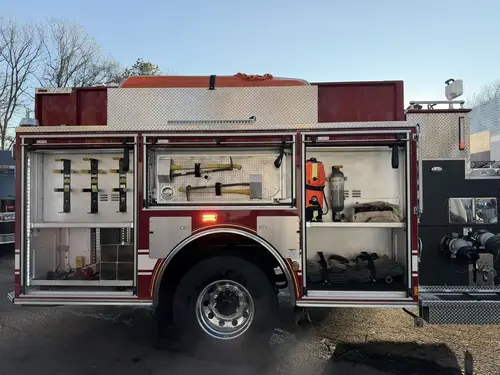 Officer-side profile view with open compartments showing tools and shelf storage