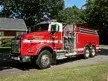 Small front-left exterior thumbnail of tanker truck on grass