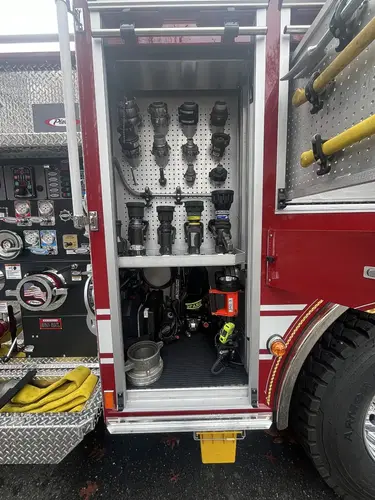 Open pump panel compartment showing gauges, valves, and lever controls