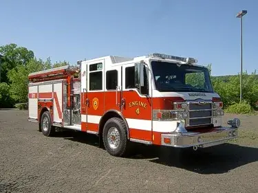 Front-right exterior view showing cab and side compartments