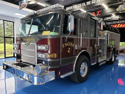 Pumper front-left exterior view showing dark cab top and side body