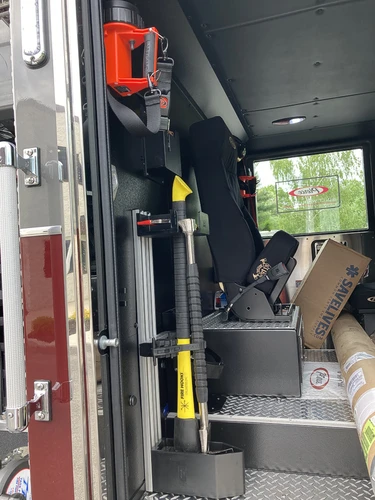 Open rear crew area showing cone and mounted long tools
