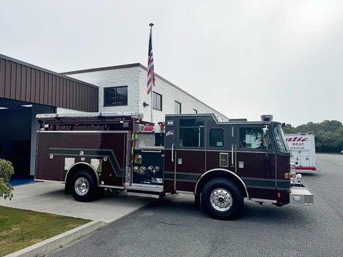Officer-side profile view showing side compartments, cab doors, and wheel area.