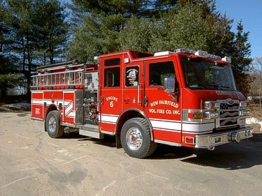 Front-right exterior view showing cab and side compartments