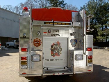 Rear view showing rear door panel, warning lights, and lower step