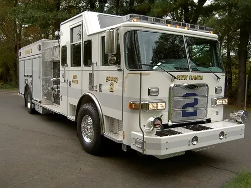 Rescue squad truck front-left exterior view showing enclosed cab and long body