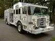 Rescue squad truck front-left exterior view showing enclosed cab and long body