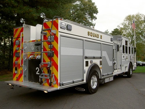 Rear-right exterior view showing side compartments and rear chevrons