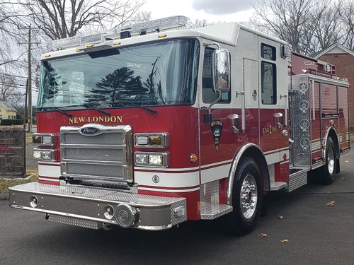 Pumper front-left exterior view showing grille, bumper, and enclosed cab