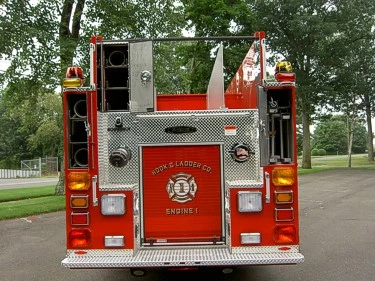 Direct rear view showing rear hose tube storage and centered panel door