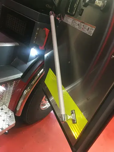 Cab step area close-up showing fold-out step and lower body panel