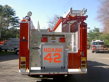 Rear view showing tailboard, warning lights, and rear panel marked 42