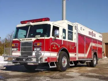 Rescue truck front-left exterior view showing enclosed cab and long body