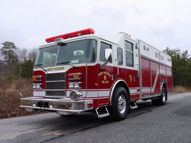 Front-right exterior view showing bumper, cab, and long rescue body