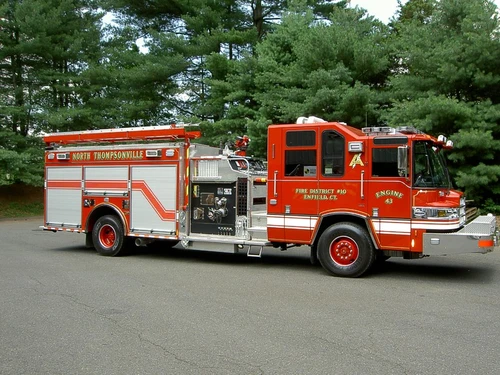 Driver-side profile view showing side compartments and wheel area