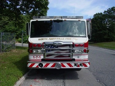 Head-on front view showing the grille, bumper intake area, warning lights, and windshield.