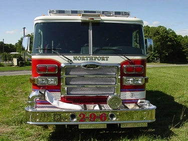 Head-on front view showing grille, windshield, warning lights, and front intake ports.