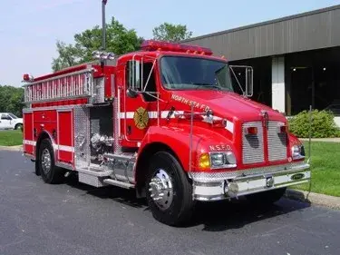 Tanker-pumper front-left exterior view showing Kenworth-style cab and long body