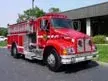 Tanker-pumper front-left exterior view showing Kenworth-style cab and long body