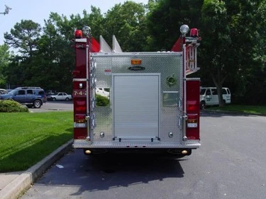 Rear view showing rear panel, warning lights, and lower step