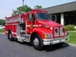 Tanker-pumper front-left exterior view showing Kenworth-style cab and long body