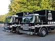 Wide front left view of the two hazmat support trucks parked together on pavement.