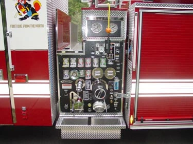 Pump panel close-up showing gauges, valves, and control levers