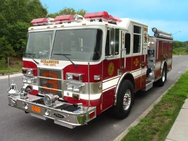 Front-left exterior view showing grille and side body parked curbside