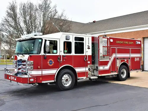Pumper front-left exterior view showing grille, bumper, and crew cab