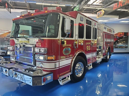 Pumper front-left exterior view showing grille, bumper, and crew cab