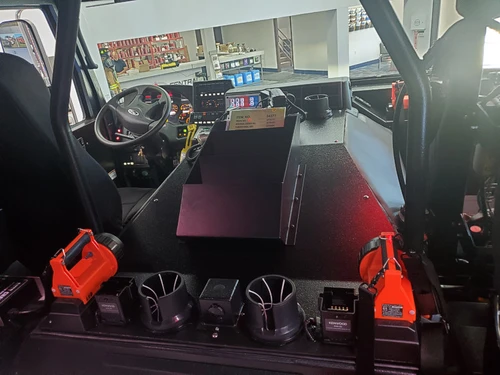 Cab interior view showing rear seats and center work table area
