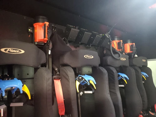 Open rear crew area showing SCBA seat mounts and restraint straps